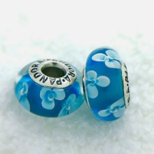 Pandora pair of sea blue flower Muranos.